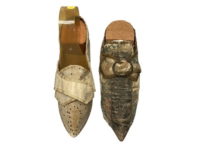 Lot 2100 - 18th century ladies' shoes, a brocade shoe with buckle, wide high heel and rising pointed toe plus a leather with small sequins