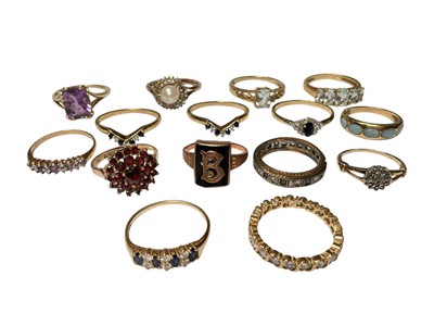 Lot 1 - Thirteen 9ct gold gem set dress rings, mostly by QVC, and two 14ct gold rings (15)