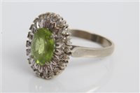 Lot 3284 - White gold (18ct) peridot and diamond cluster...