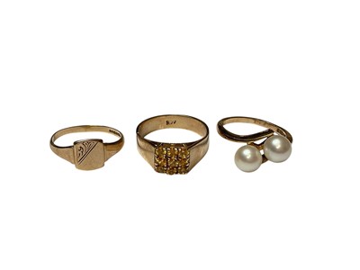 Lot 83 - Three 9ct gold rings to include a two cultured pearl cross over ring, yellow stone cluster ring and a signet ring
