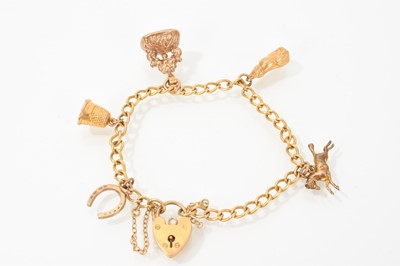 Lot 457 - 9ct gold charm bracelet