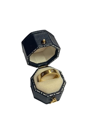 Lot 99 - 18ct gold diamond set wedding ring with seven brilliant cut diamonds in rub over setting