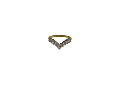 Lot 102 - 18ct gold diamond wishbone ring