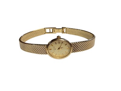 Lot 33 - W. H. Wilmot 9ct gold ladies wristwatch with integral 9ct gold articulated mesh bracelet, boxed