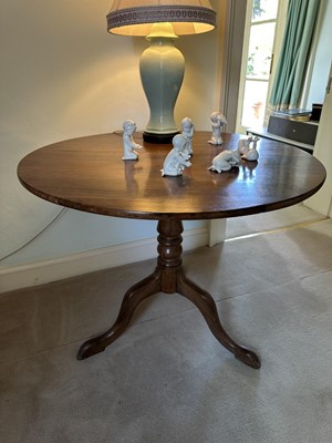Lot 1254 - George III style mahogany tripod supper table, the circular tilt top on shaped column and three splayed legs, 91cm diameter
