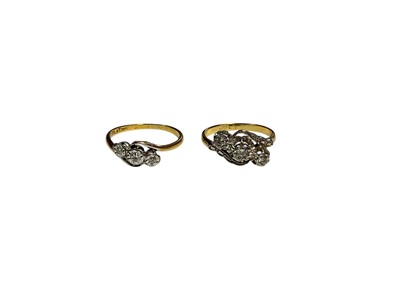 Lot 14 - Two 18ct gold diamond three stone cross-over rings in platinum illusion settings