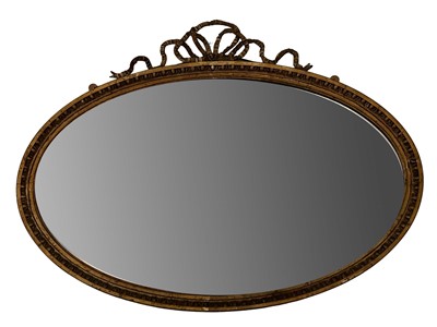 Lot 1257 - Late Victorian gilt oval mirror with ribbon surmount