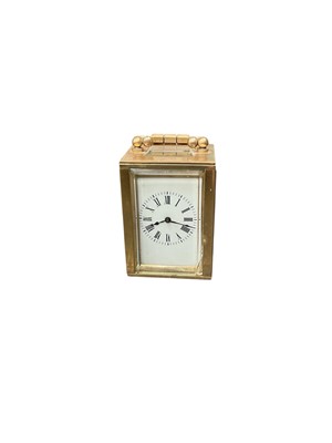 Lot 2438 - Miniature brass cased carriage clock