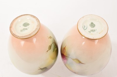 Lot 13 - Pair of Royal Worcester vases hand painted with flowers, one signed H Martin