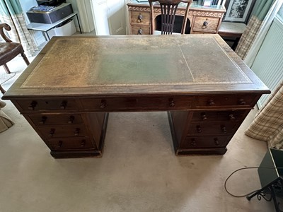 Lot 1258 - Late Victorian mahogany twin pedestal desk, the brown leather lined top above an arrangement of nine drawers with bun handles, 152cm wide x 83cm deep x 75cm high