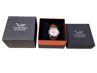 Lot 125 - Vostok automatic wristwatch with silvered dial, day & night indicator and date aperture at 6 o'clock in a rose gold plated stainless steel case, 43mm diameter, on a brown leather strap. Boxed as new