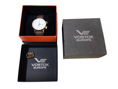 Lot 126 - Vostok Dualtime automatic wristwatch with white dial and date aperture at 6 o'clock in a rose gold plated stainless steel case
