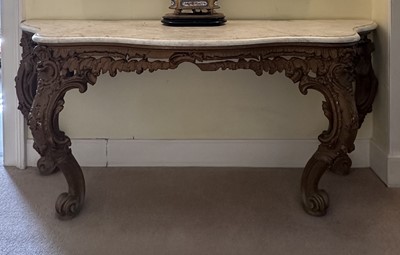 Lot 1260 - 19th century gilt painted and carved console table on four scroll cabriole legs with floral crestings and a serpentine marble top