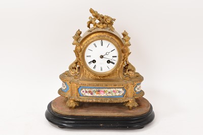 Lot 634 - 19th century French gilt brass mantel clock with inset porcelain panels