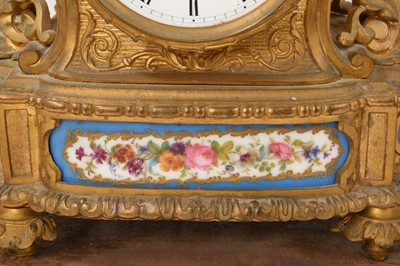 Lot 634 - 19th century French gilt brass mantel clock with inset porcelain panels
