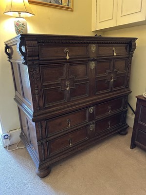 Lot 1262 - 17th century oak geometric chest with an arrangement of four long drawers, each with brass drop handles, on turned bun feet