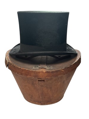 Lot 2105 - Tress & Co top hat in leather top hat box, a London bowler size 7 and a straw boater