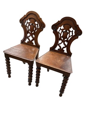 Lot 1420 - Pair of mid 19th century carved oak hall chair...