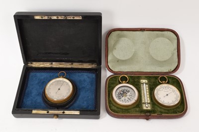 Lot 702 - Victorian pocket barometer in fitted ebony case and a Victorian pocket compass and barometer and thermometer in fitted leather case (2)