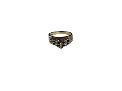 Lot 28 - 1970s 18ct white gold diamond and sapphire ring