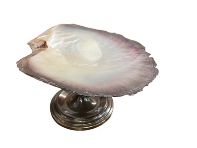 Lot 190 - Mother of Pearl shell, raised on a silver plated pedestal base.
