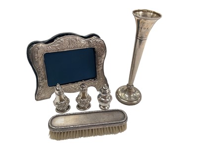 Lot 1007 - Silver spill vase, silver mounted photograph frame, silver mounted brush and three silver condiments