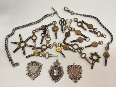 Lot 1008 - Collection of watch winding keys, three silver fobs and two silver/white metal part watch chains