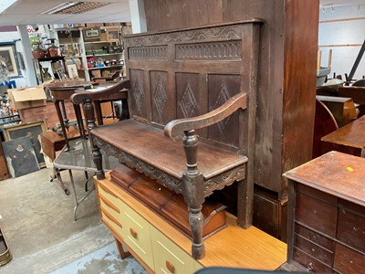 Lot 1342 - Antique carved and panelled oak settle