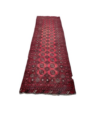 Lot 1375 - Bokara runner and two persian rugs (3)
