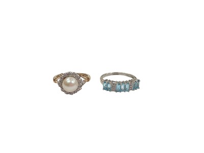 Lot 1010 - 9ct gold cultured pearl and diamond ring, together with 9ct white gold blue topaz and diamond ring (2)