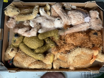 Lot 50 - Two boxes of dolls and doll's clothes, and two boxes of teddy bears (4 boxes)