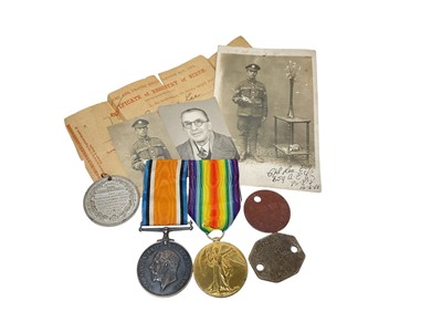 Lot 650 - First World War pair comprising War and Victory medals named to 40874 CPL. E. J. Lee. Essex. R. together with a school attendance medal also named to Lee, dog tags and photographs of Edward Lee...