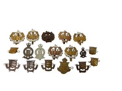 Lot 675 - Collection of eighteen Essex Regiment cap badges to include a Second World War Economy issue example, Essex Yeomanry and Essex Volunteer Regiment badges (18)