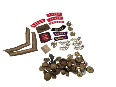 Lot 677 - Collection of Victorian and later Essex Regiment buttons, badges and shoulder titles including some cloth examples.