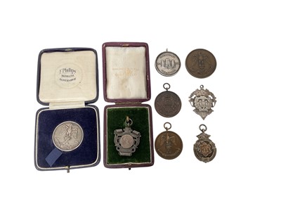 Lot 679 - Group of Essex Regiment related silver prize fobs and medals, together with some bronze examples (8)