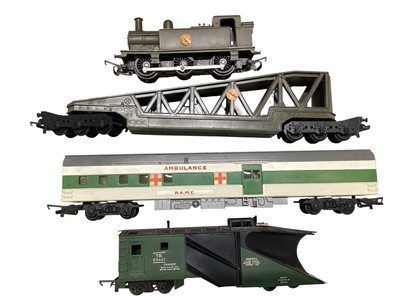 Lot 1964 - Tri-ang OO Gauge loose military Tank engine, rocket launchers, helicopter transporters and other military rolling stock (1 box)