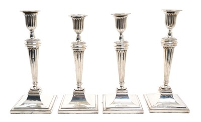 Lot 156 - Four silver plated candlesticks