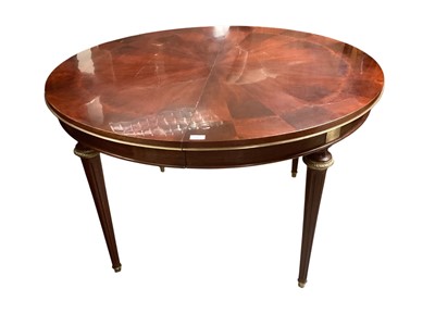 Lot 1361 - A mahogany French round table 120 cm diameter, with two drop in leaves to seat 8