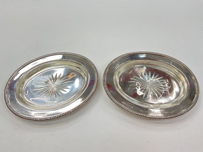 Lot 1039 - Pair of 1920s oval silver dishes with clear glass liners by Carrington & Co Ltd. (Birmingham 1928)