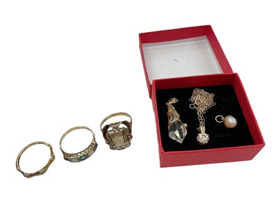 Lot 1095 - 9ct gold smoky quartz cocktail ring, 9ct gold opal and blue stone ring, 9ct gold diamond set bamboo-style ring, together with three 9ct gold mounted gem set pendants, one on 9ct gold chain