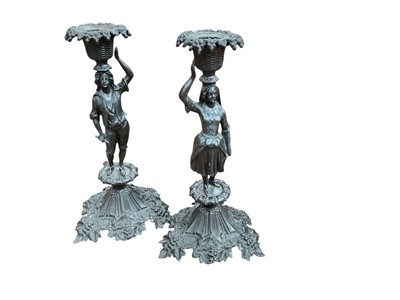 Lot 456 - Pair of Continental figural candlesticks and a group of assorted silver plated flatware.