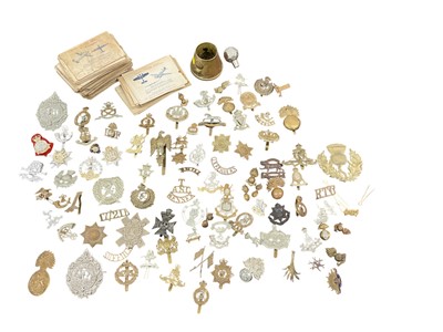 Lot 780 - Collection of sixty plus British military cap badges together with a brass trench art ashtray and collection of aircraft recognition cards, (1 box).