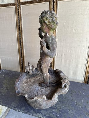Lot 1279 - Antique cast iron bird bath mounted with a putto standing with a shell, a bird to the rim, 56cm high
