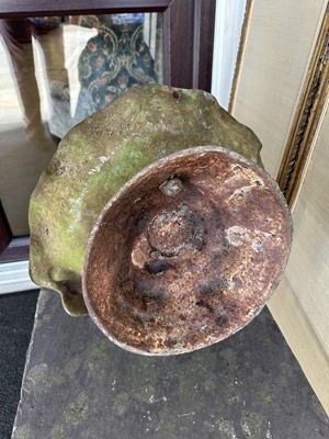 Lot 1279 - Antique cast iron bird bath mounted with a putto standing with a shell, a bird to the rim, 56cm high