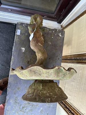 Lot 1279 - Antique cast iron bird bath mounted with a putto standing with a shell, a bird to the rim, 56cm high