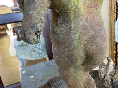 Lot 1279 - Antique cast iron bird bath mounted with a putto standing with a shell, a bird to the rim, 56cm high