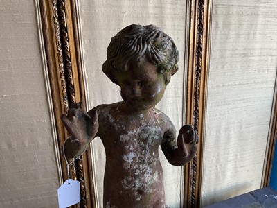 Lot 1279 - Antique cast iron bird bath mounted with a putto standing with a shell, a bird to the rim, 56cm high