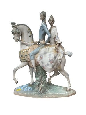 Lot 211 - Lladro porcelain figure of couple on horseback