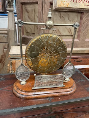 Lot 34 - Edwardian dinner gong with racquet supports and net with one loose striker in the form of a racquet