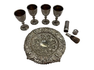 Lot 1156 - Edwardian silver cased travelling shaving brush, four plated egg cups and white metal embossed dish